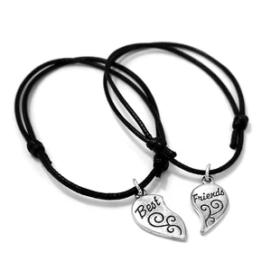 Kép 1/2 - páros-fekete-zsinórszövet-karkötő-best-friends-charmmal