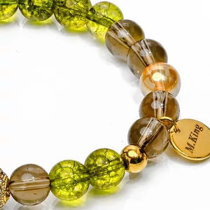 Kép 3/7 - peridot-füstkvarc-és-arany-angyal-aura-ásvány-karkötő-több-méretben