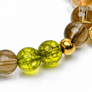 Kép 7/7 - peridot-füstkvarc-és-arany-angyal-aura-ásvány-karkötő-több-méretben